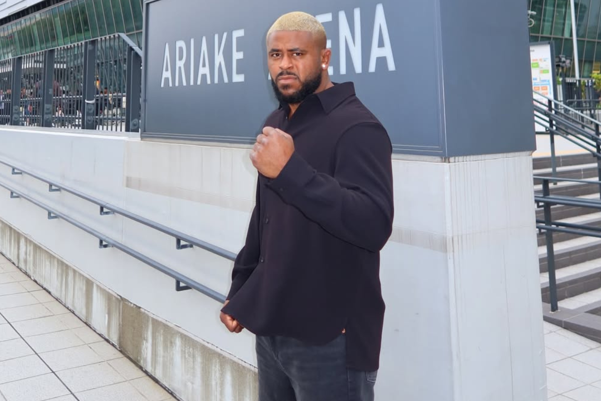 Regan Upshaw poses outside Tokyo