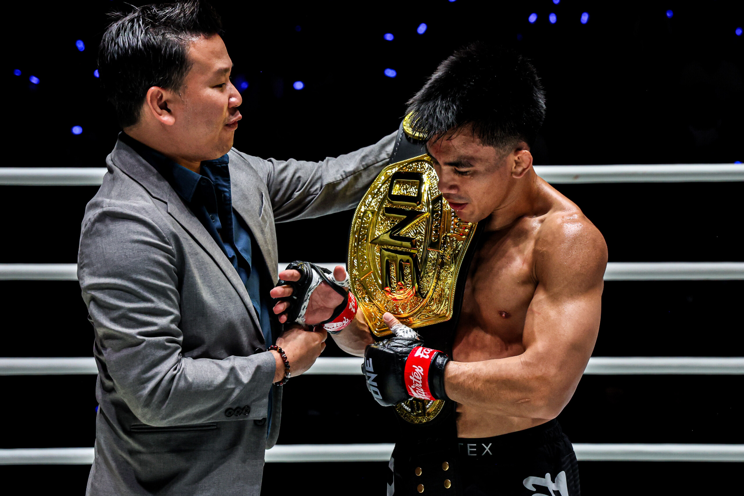 Plai hands Joshua Pacio the ONE Championship belt