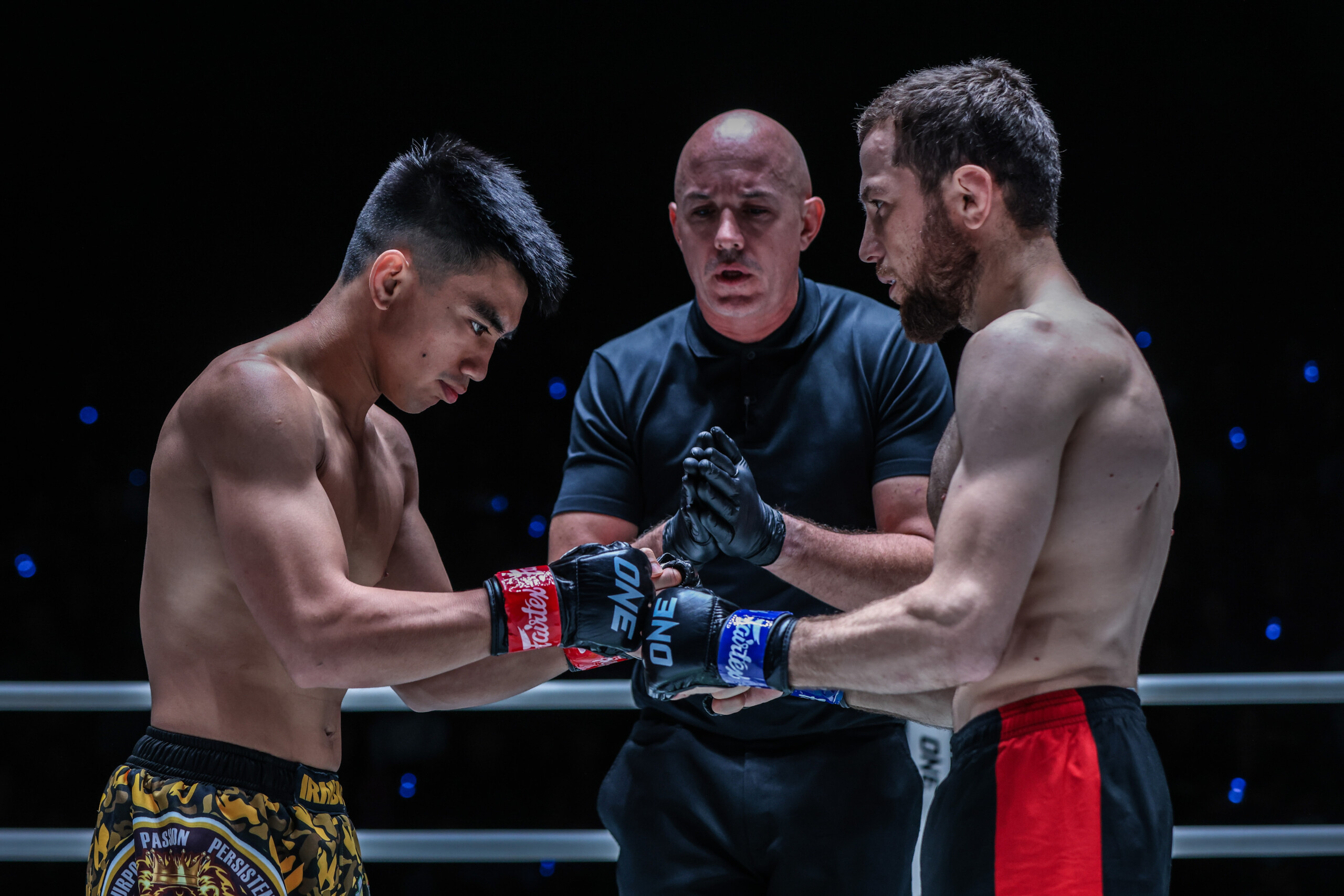 Joshua Pacio and Mansur Malachiev touch gloves before their fight at ONE Fight Night 15